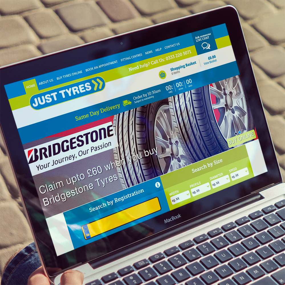 Website design example for Just Tyres on a laptop